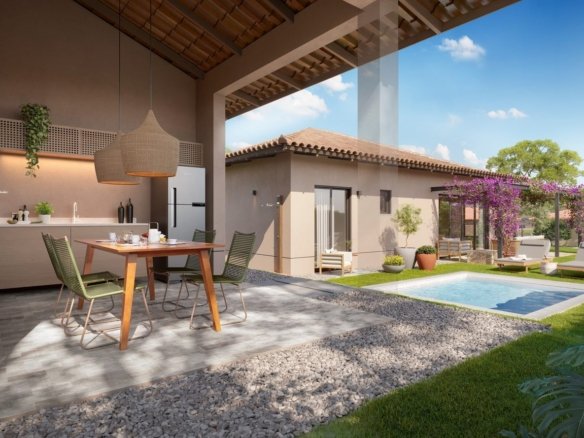 Edícula com cozinha e mesa, aberta para o jardim e a piscina, em uma casa da Frente Estrada do Toriba Sudoeste (imagem ilustrativa)