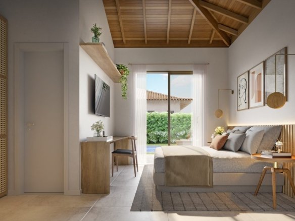 Suíte decorada com cama de casal e porta de vidro para o jardim, em uma casa da Frente Estrada do Toriba Sudoeste (imagem ilustrativa)