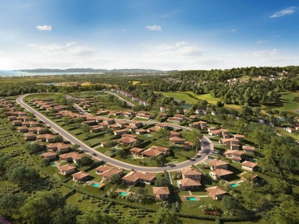 Vista aérea do projeto do Vista Ybirá, com as casas ao longo das ruas, o campo de golfe e o mar ao fundo (imagem ilustrativa)
